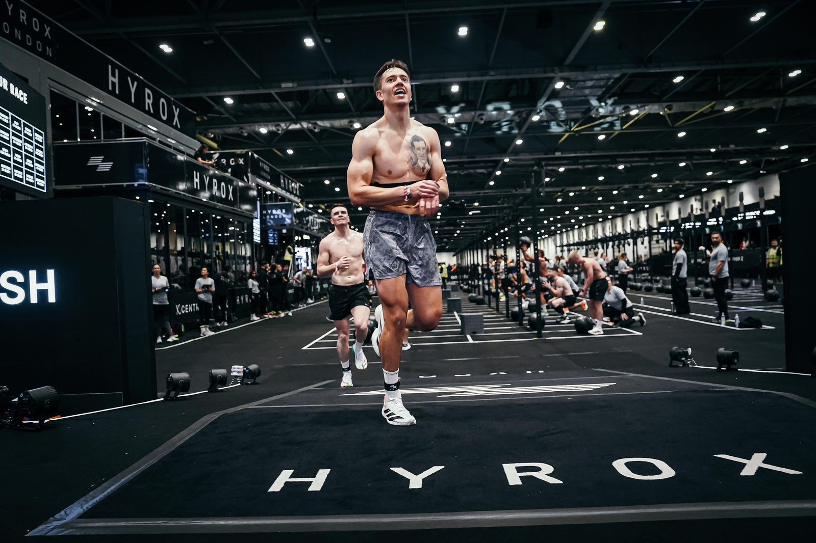 Athlete running at the HYROX London race