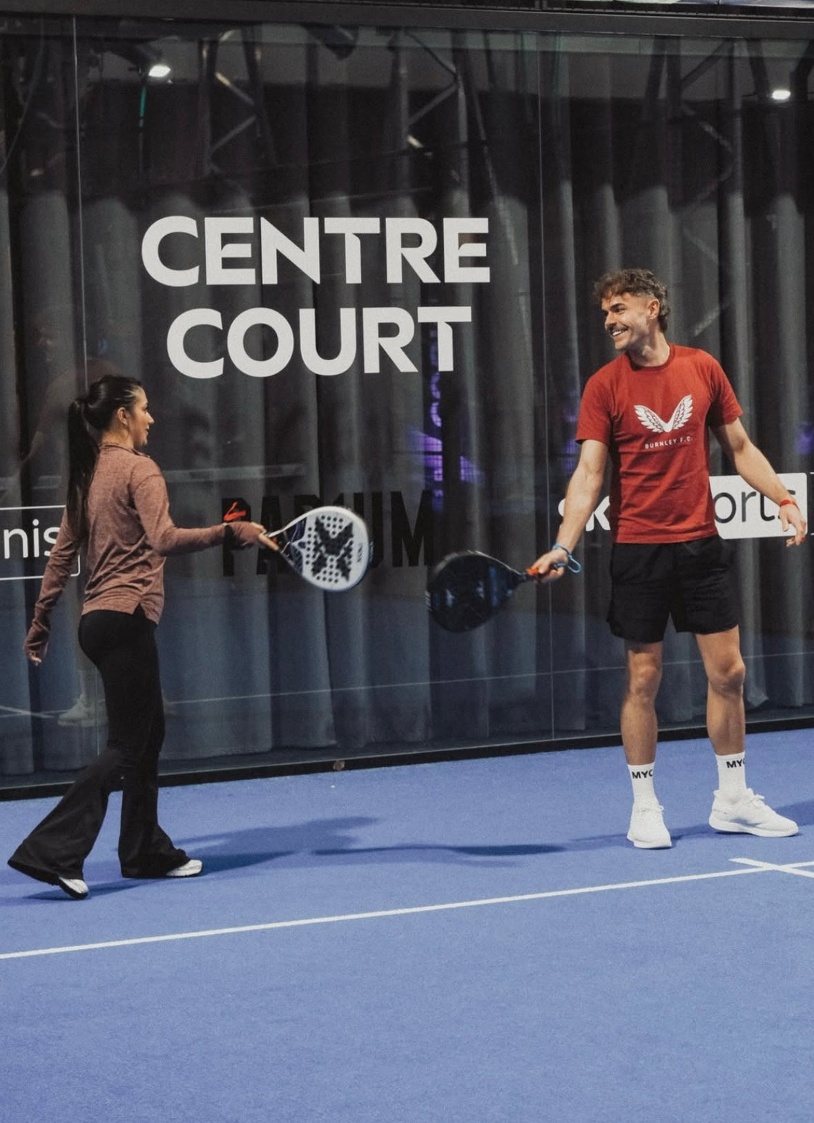 Padel player wearing MYC Performance socks on centre court